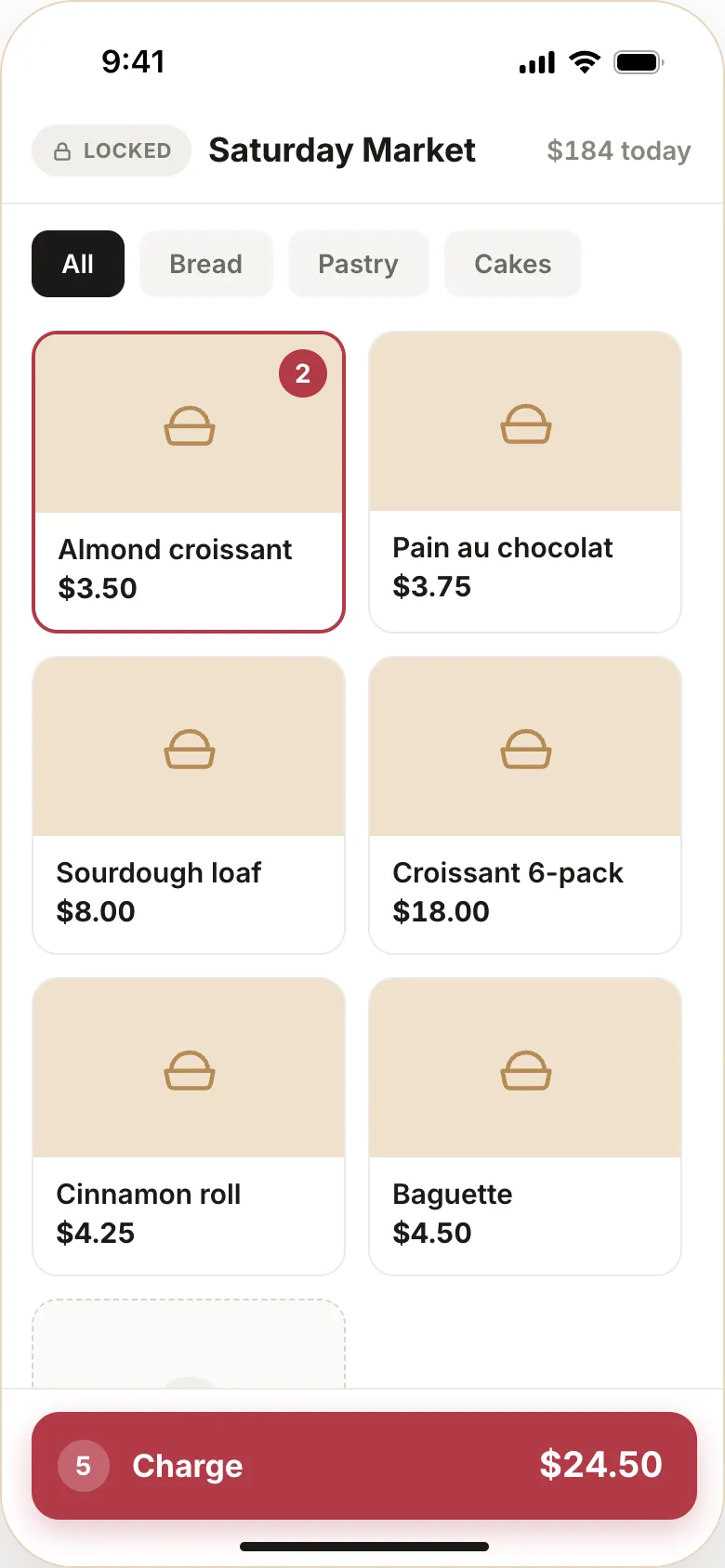 The Butterbase kiosk screen at a Saturday market: six products with their prices, two almond croissants in the basket, and a Charge button for $24.50